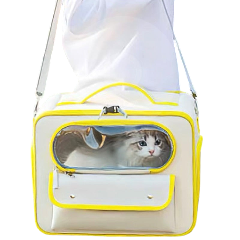 The Tailored Tail beige and yellow Oxford fabric pet travel bag with a transparent window carrying a cat