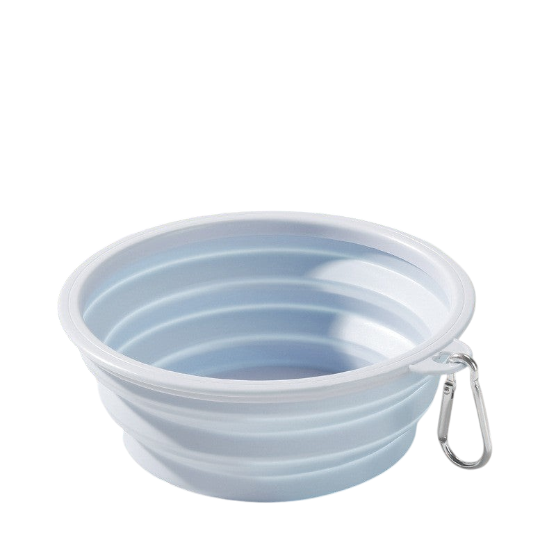 The Tailored Tail light blue collapsible silicone pet bowl with a metal carabiner for travel.