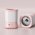 The Tailored Tail electric pet paw cleaner in white and pink with soft internal silicone bristles for gentle cleaning.