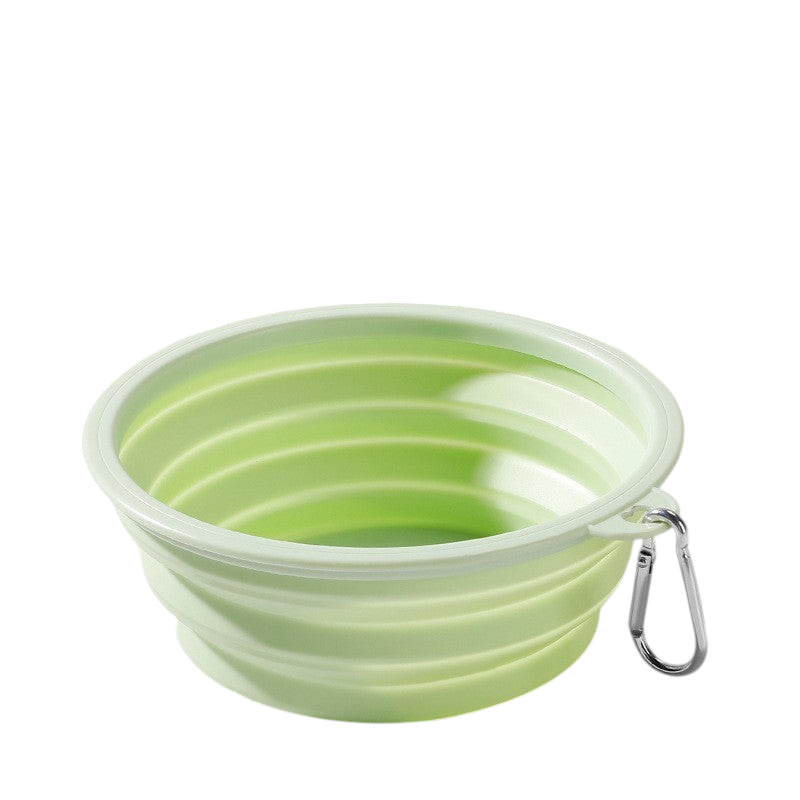 The Tailored Tail light green foldable silicone pet bowl with a metal carabiner for travel and outdoor use.