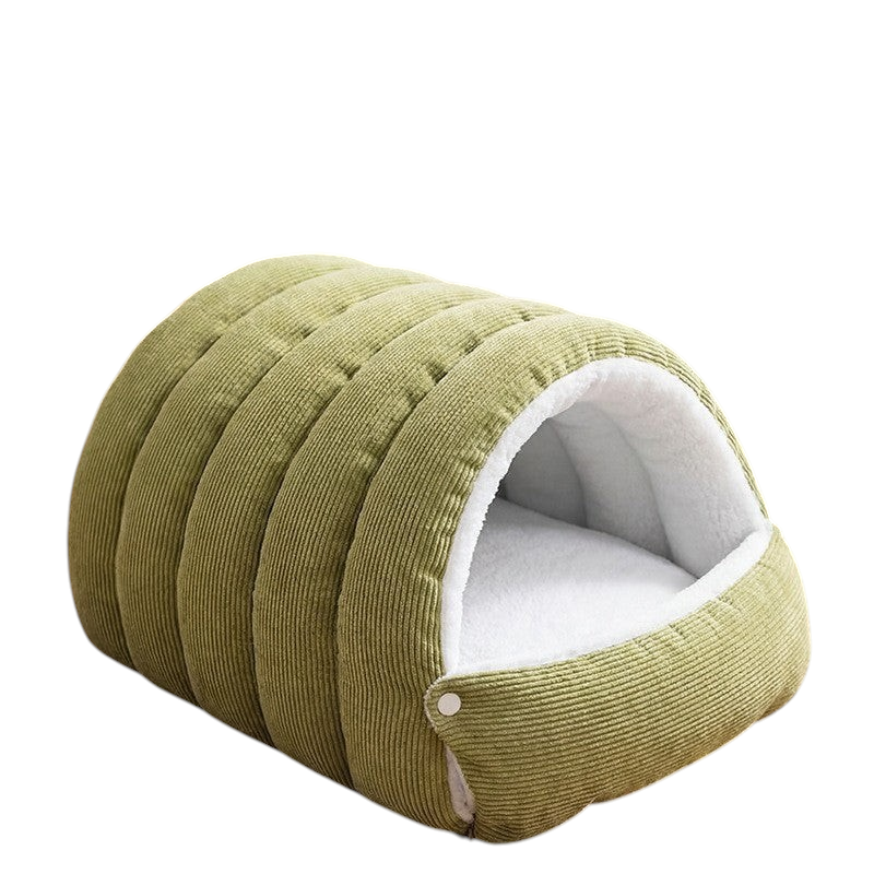The Tailored Tail green corduroy cave-style cat bed with a soft white plush interior for warmth and comfort.