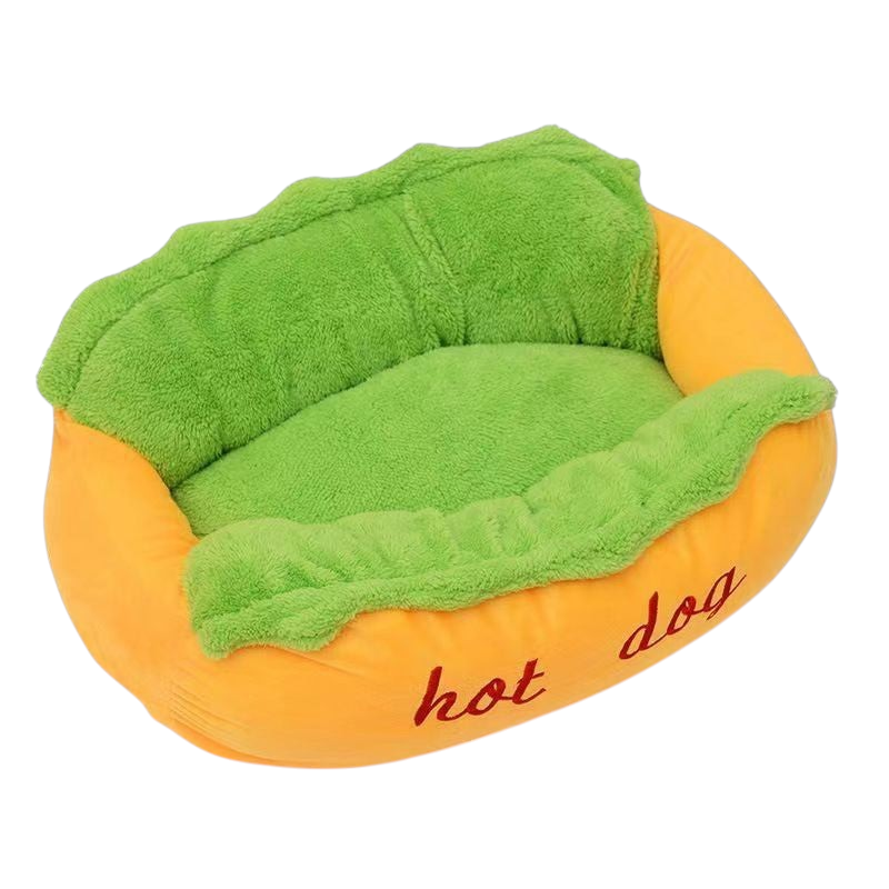 The Tailored Tail plush hot dog pet bed for small dogs and cats with a vibrant orange exterior and green interior.