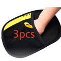 The Tailored Tail electrostatic pet hair remover glove in black with yellow trim being worn on a hand