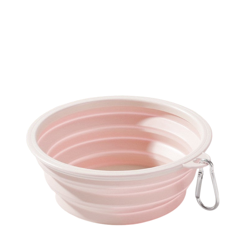 The Tailored Tail pink collapsible silicone pet bowl with a metal carabiner for travel and outdoor use.